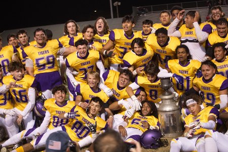The entire Tiger football team celebrates with the Milkcan moments after defeating Hanford in the WYL finale 42-15.